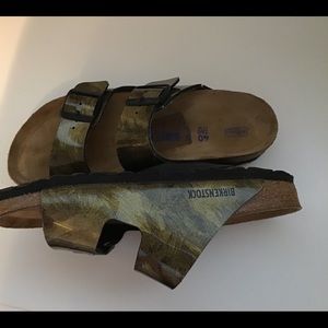 Gold and black Birkenstock’s